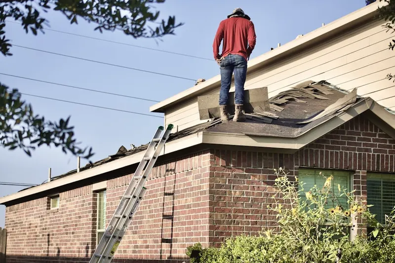 Professional roofer working on a residential roof in Buckeystown Station